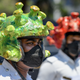 Traffic police personnel wearing coronavirus-themed helmets participate in a campaign to educate the public during a government-imposed nationwide lockdown as a preventive measure against the COVID-19 coronavirus in Bangalore on March 31, 2020.